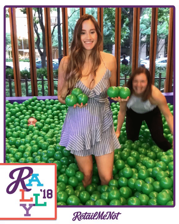 Boomernag GIF of two girls jumping in a ball pit.
